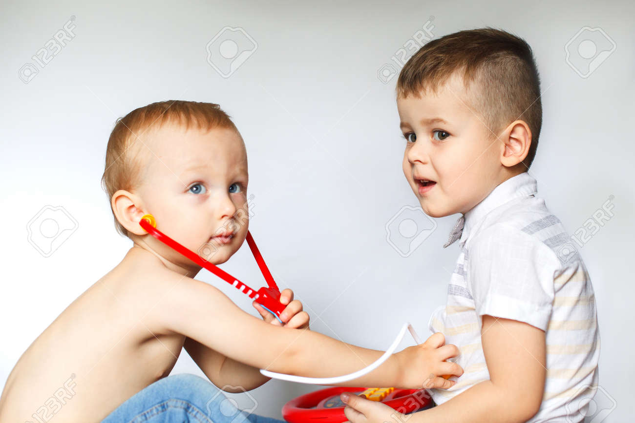 children playing doctor and patient two little boys using stethoscope children play doctor