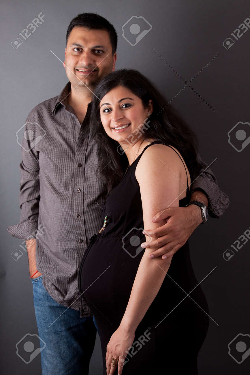 His Pregnant Wife Stock Photo