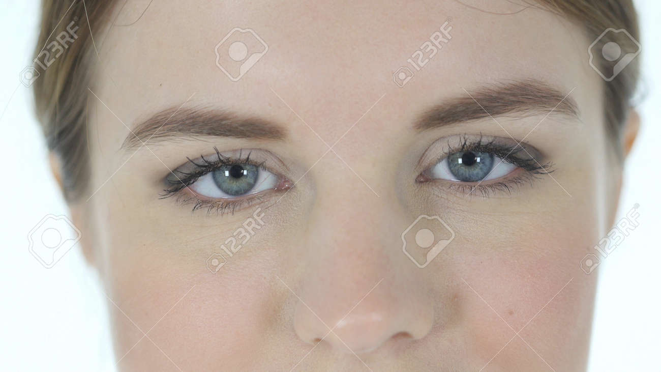 blinking eyes of woman isolated on white background stock photo