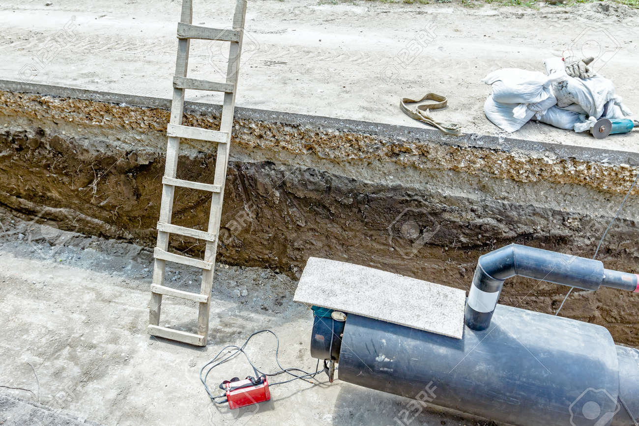 wooden ladders are used for access into trench to welding pipeline welding pipe line