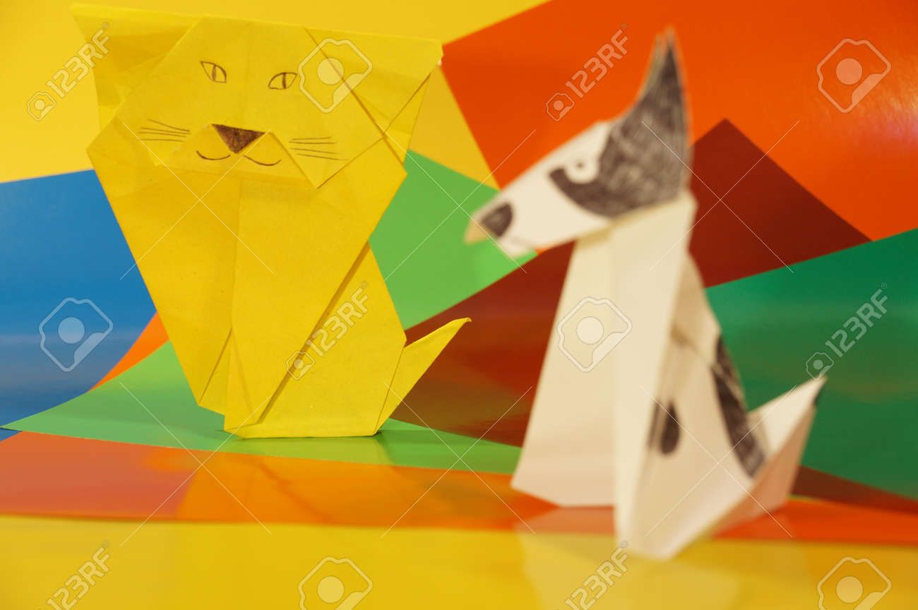 Origami Cat And Dog Made Of Paper On Paper Background