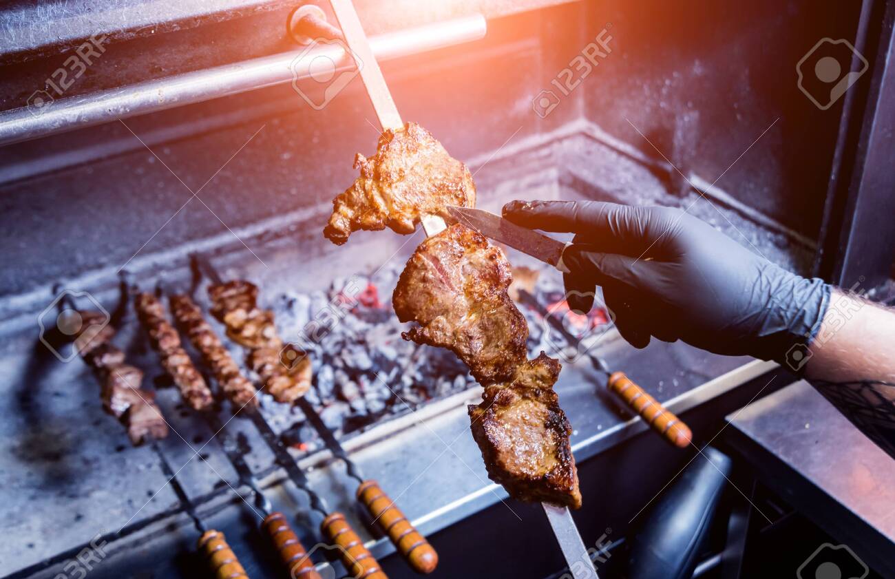 Chef Cooking Delicious Beef And Pork Barbecue On Grill Chef Cooking Delicious Beef And Pork Barbecue On Grill
