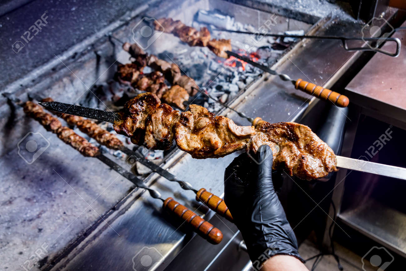 Chef Cooking Delicious Beef And Pork Barbecue On Grill Chef Cooking Delicious Beef And Pork Barbecue On Grill