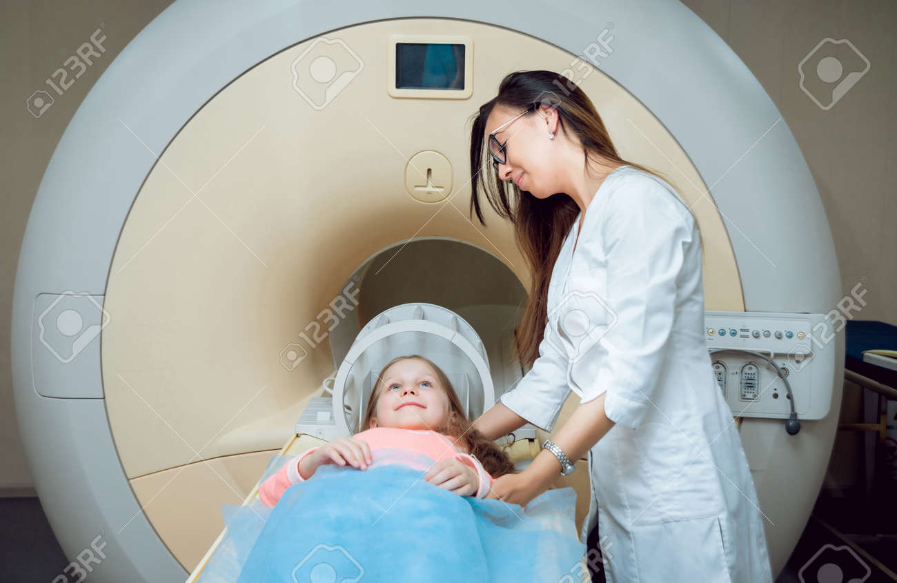 Medical equipment. Doctor and patient in MRI room - 145148700 Medical equipment. Doctor and patient in MRI room - 145148700