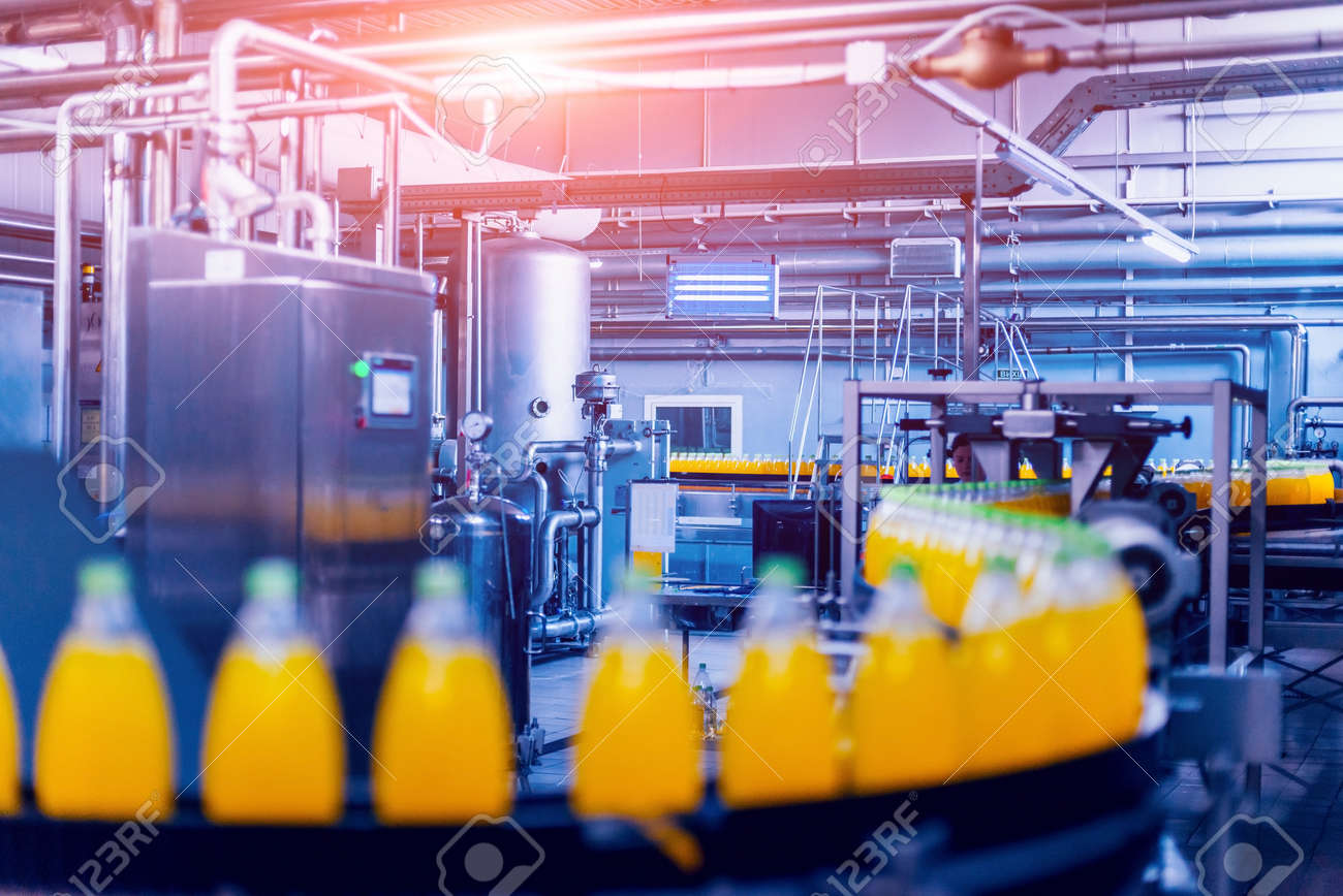 Beverage factory interior. Conveyor with bottles for juice or water. Modern equipments - 148720890 Beverage factory interior. Conveyor with bottles for juice or water. Modern equipments - 148720890