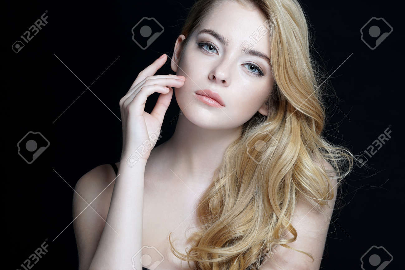 Beautiful young lady with make up face. Close-up of an attractive girl of European appearance on dark background. - 52582632 Beautiful young lady with make up face. Close-up of an attractive girl of European appearance on dark background. - 52582632