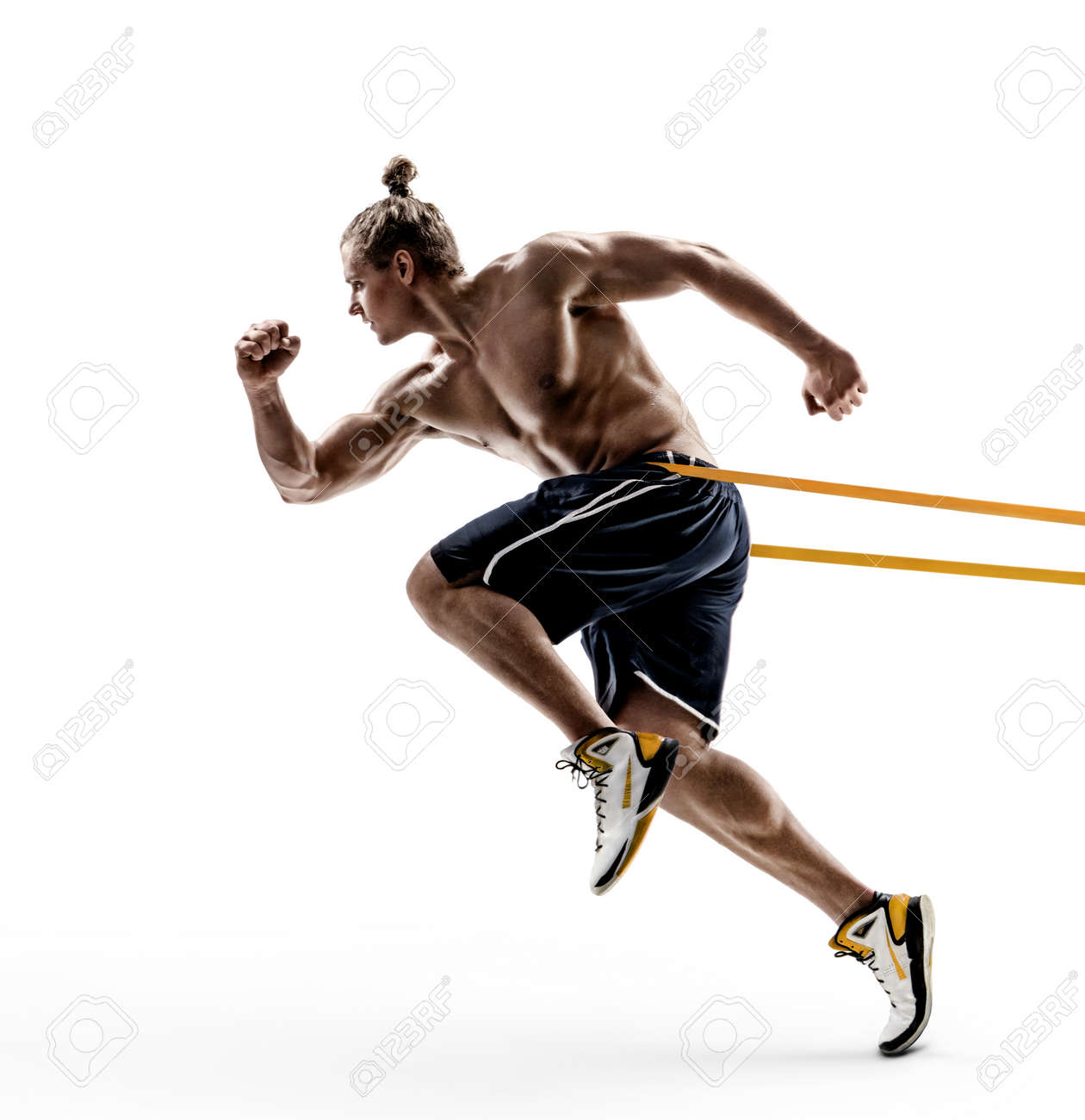 Sporty man runner in silhouette using a resistance band in his exercise routine. Photo of shirtless young man isolated on white background. Dynamic movement. Side view. Full length - 117020266 Sporty man runner in silhouette using a resistance band in his exercise routine. Photo of shirtless young man isolated on white background. Dynamic movement. Side view. Full length - 117020266