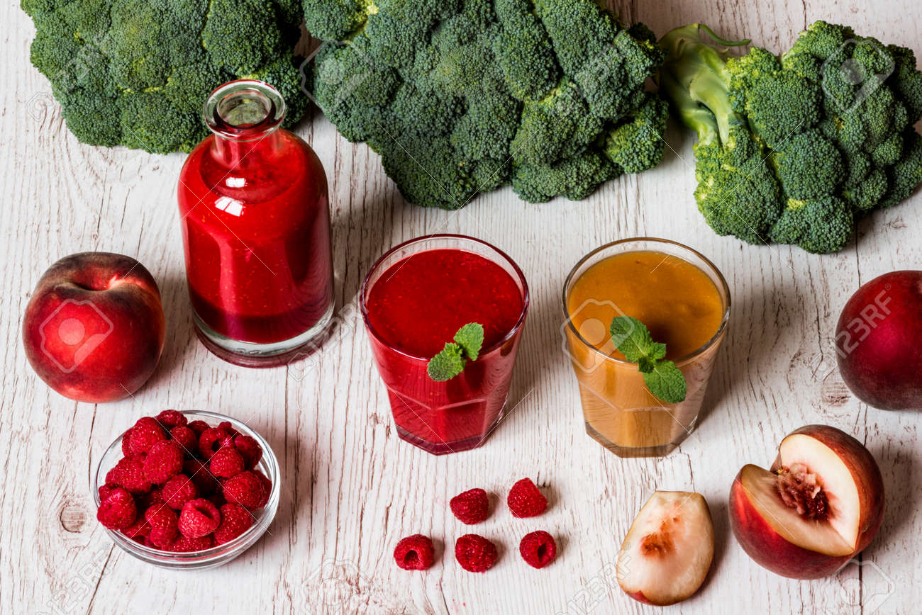 healthy drinks raspberry fresh smoothie in glass and bottle stock