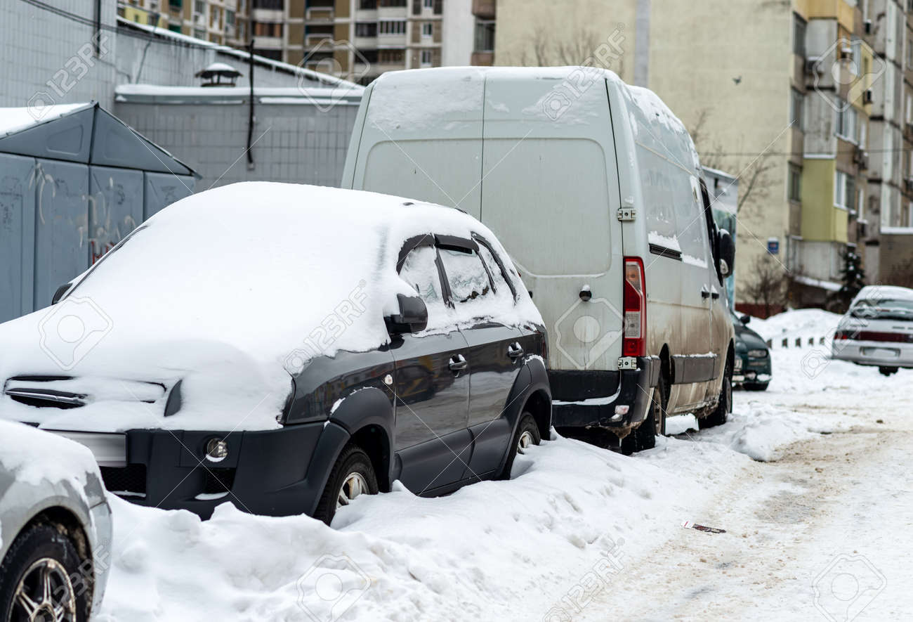 Cars stand in the yard covered with snow - 163754394 Cars stand in the yard covered with snow - 163754394