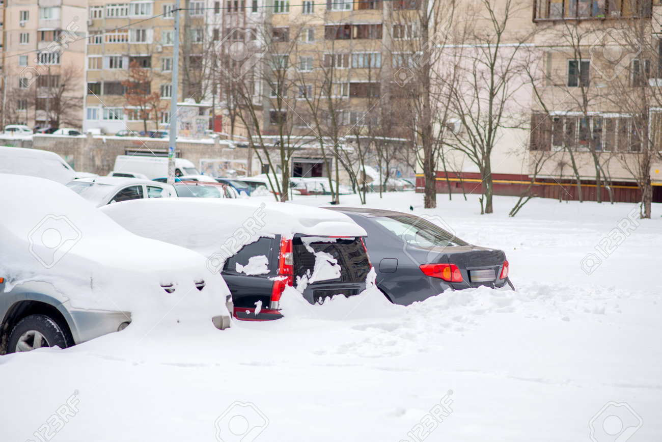 Cars covered with snow in the yard - 163918214 Cars covered with snow in the yard - 163918214