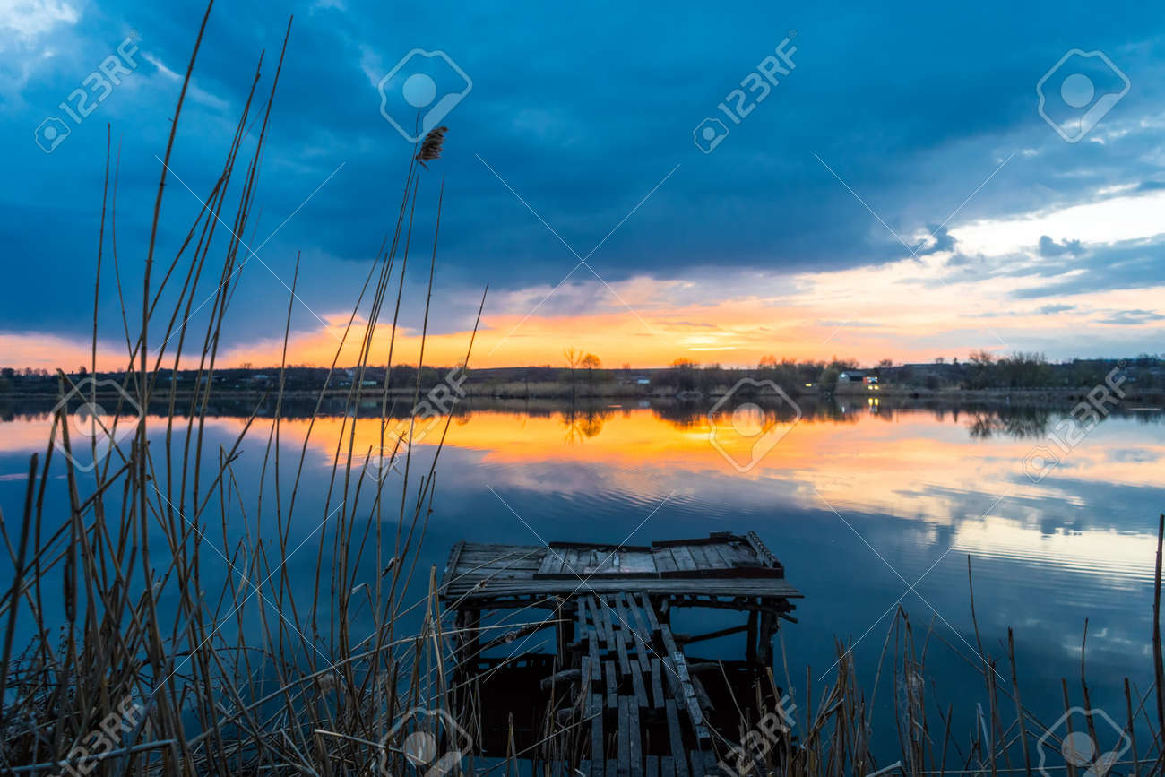 Old fishing wooden bridge on the lake at sunset - 170818671 Old fishing wooden bridge on the lake at sunset - 170818671