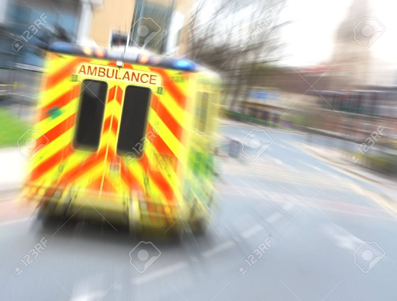 Speeding ambulance flies through city street with zoom blur - 8005235 Speeding ambulance flies through city street with zoom blur - 8005235