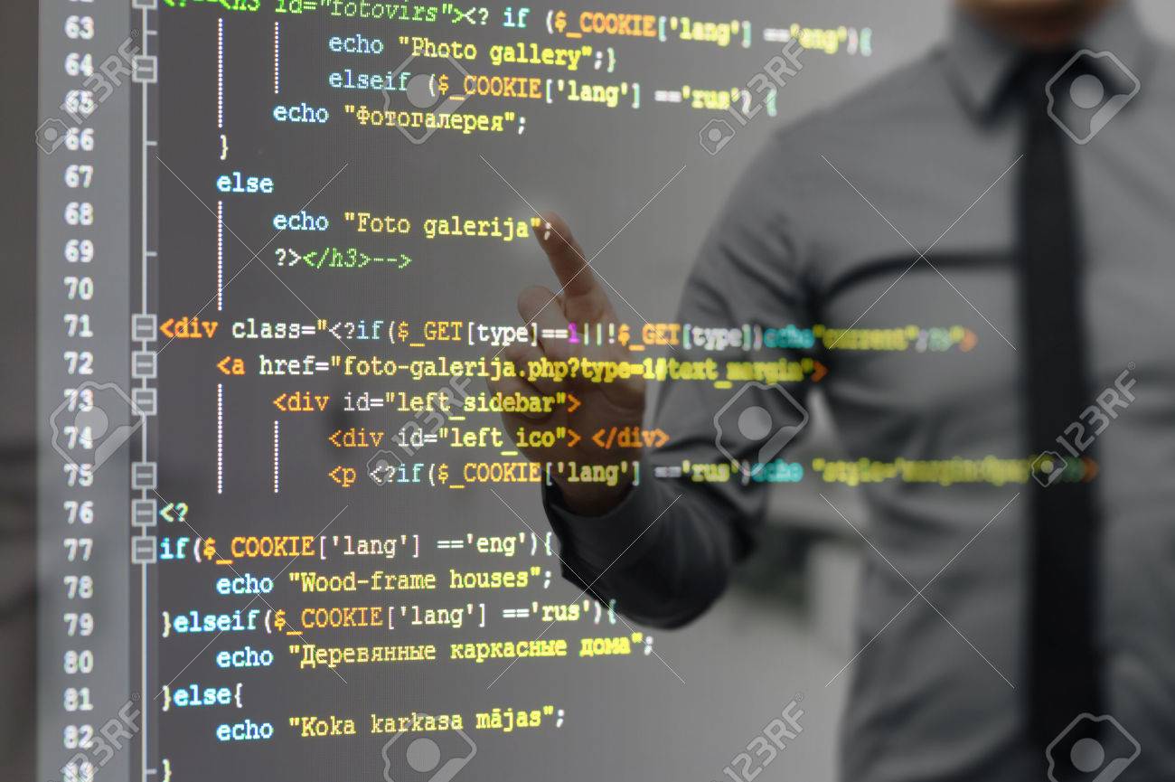 man pointing on virtual screen with website programming code - 53827861 man pointing on virtual screen with website programming code - 53827861