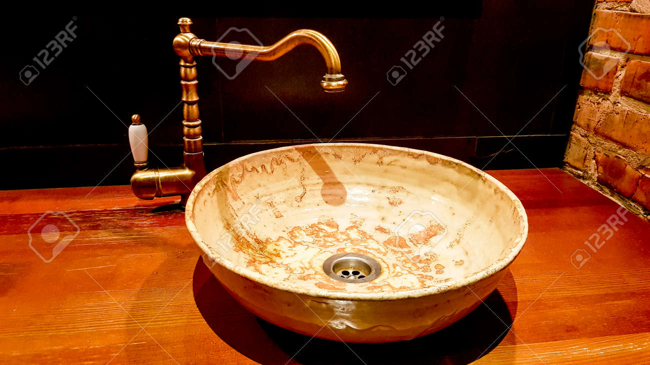 Vintage Beautiful Faucet And Golden Mixer Tap On A Marble Round Stock Photo Picture And Royalty Free Image Image 130401238