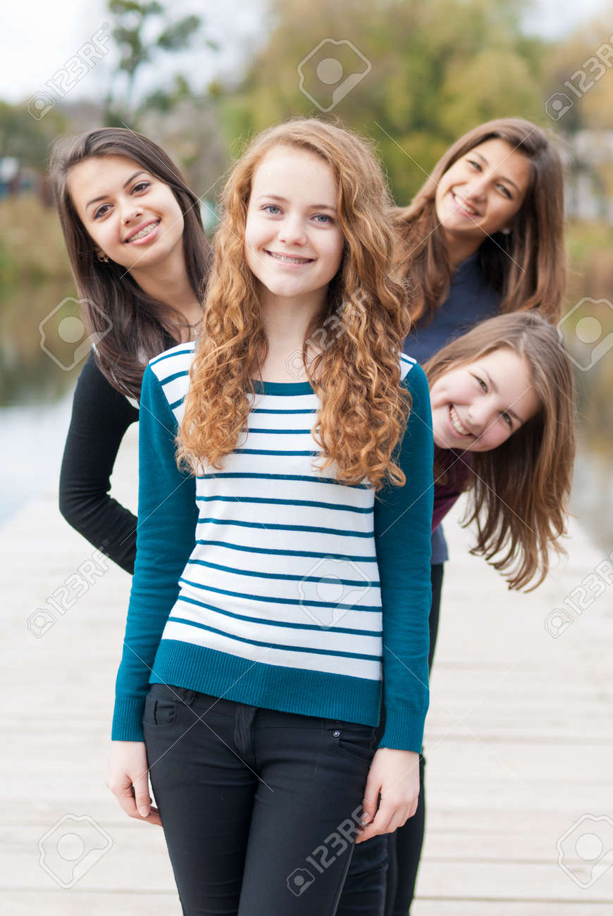 four happy teenage girls