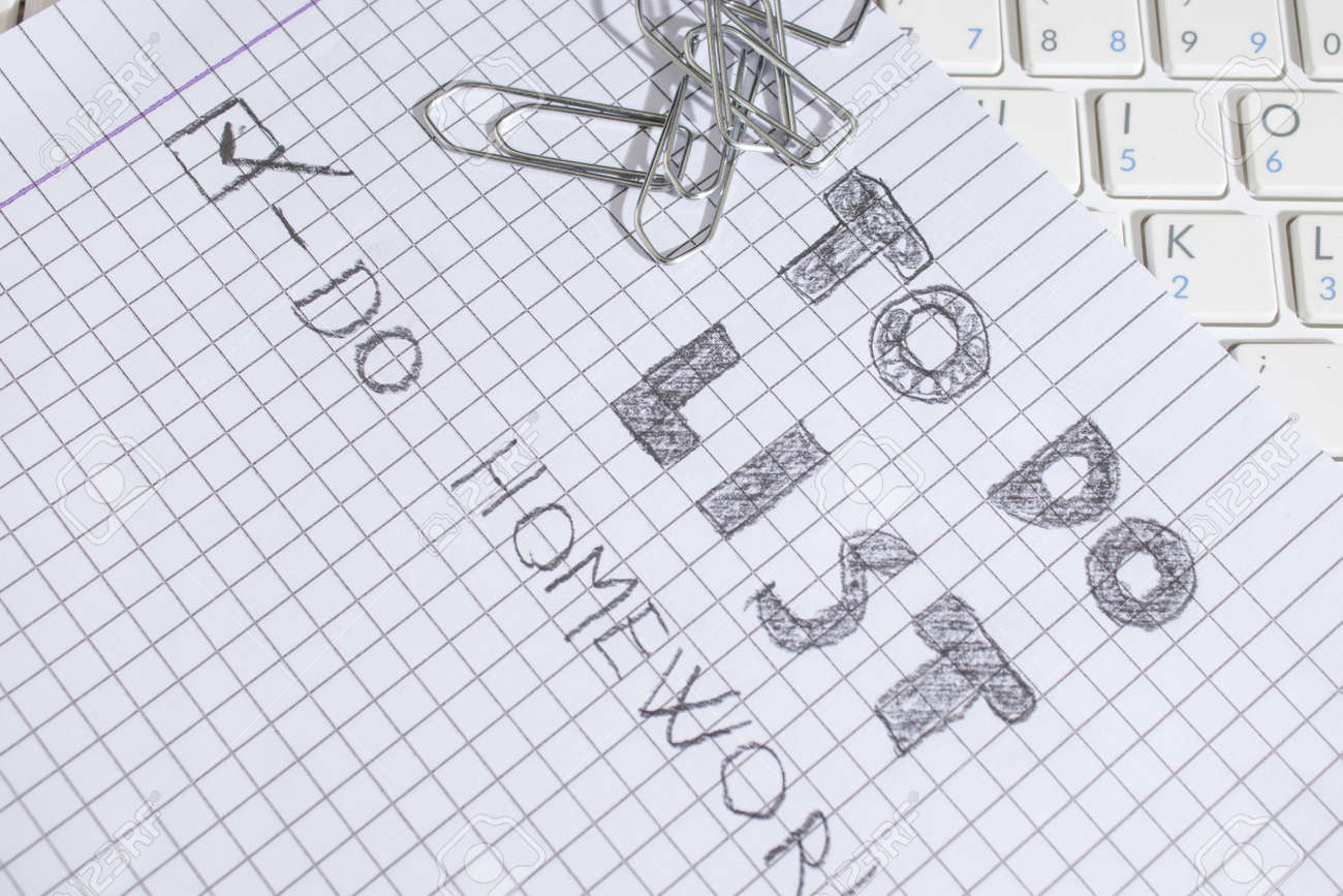 homework to do list and a keyboard with clasps composition stock homework list
