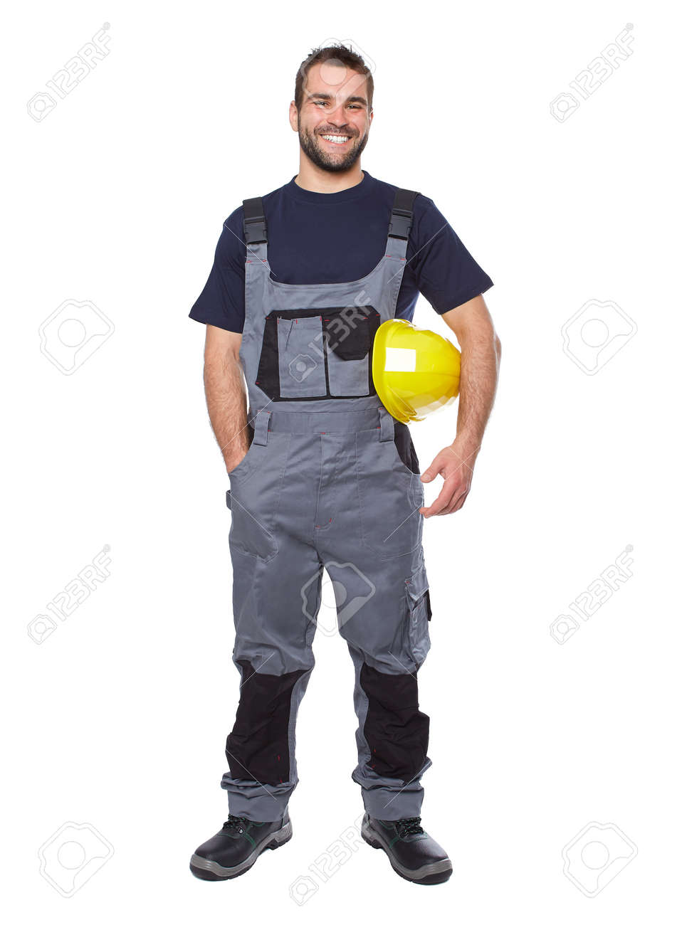 portrait of smiling worker in gray uniform isolated on white stock