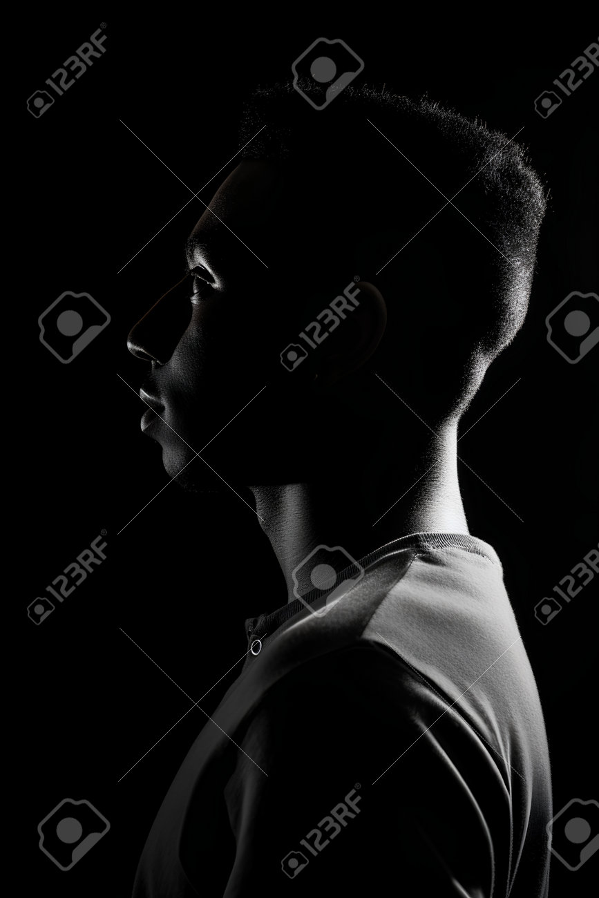 Portrait Of A Young African American Man In Profile On Black Background  Stock Photo, Picture and Royalty Free Image. Image 202697358., image size:867x1300