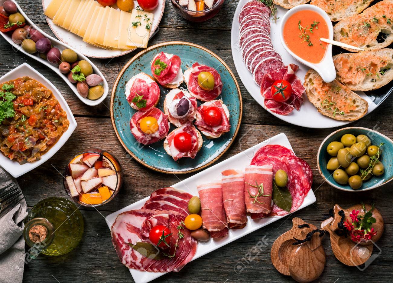 spanish tapas and sangria on wooden table top view stock photo