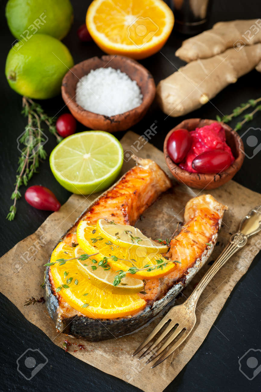 Grilled salmon with thyme on a dark background - 22995090 Grilled salmon with thyme on a dark background - 22995090