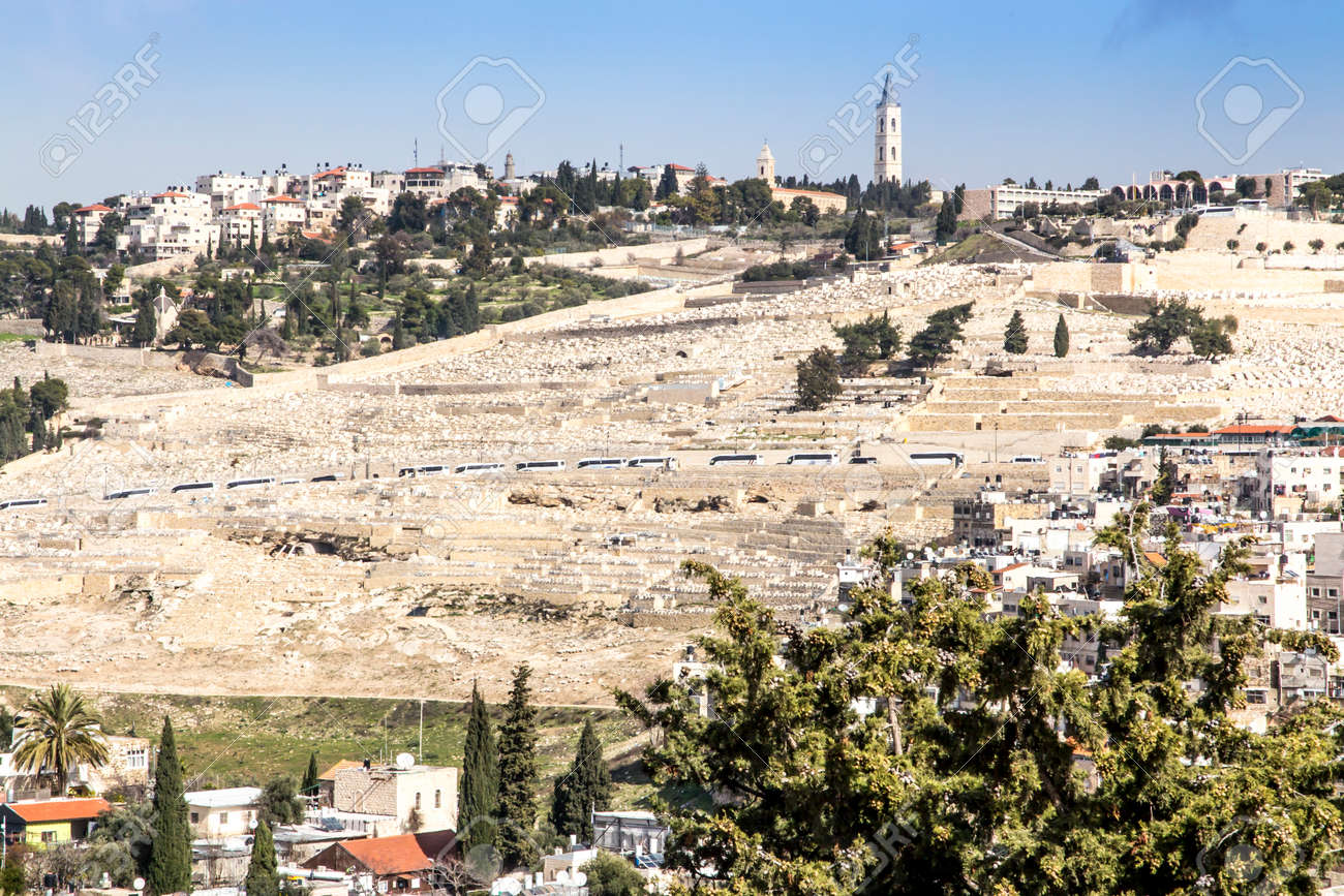 Dense buildings in one of the Jerusalem areas in Israel as a backdrop. The Mount of Olives is visible with one of the most expensive cemeteries in the world. - 157852480 Dense buildings in one of the Jerusalem areas in Israel as a backdrop. The Mount of Olives is visible with one of the most expensive cemeteries in the world. - 157852480