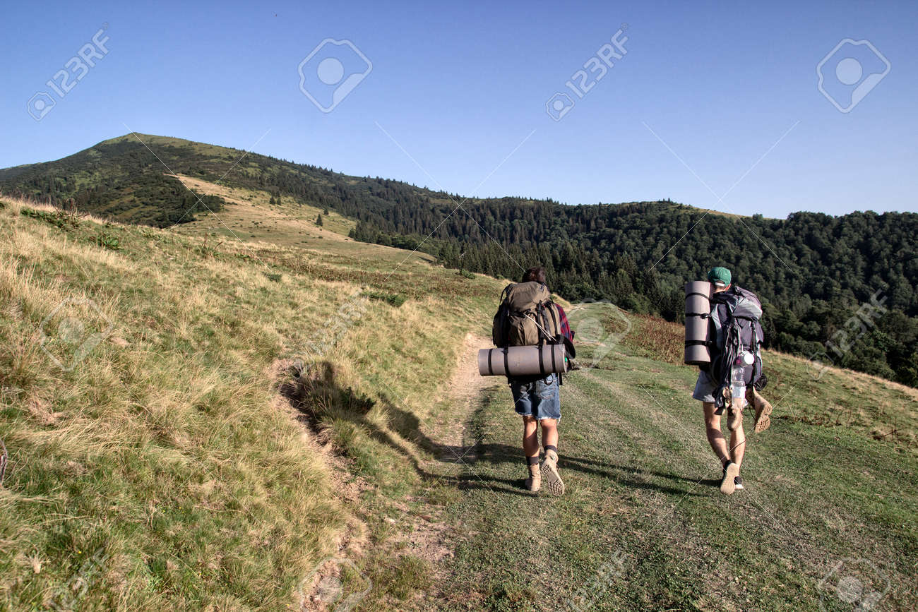 Tourists are walking in the mountians, day - 84124557 Tourists are walking in the mountians, day - 84124557