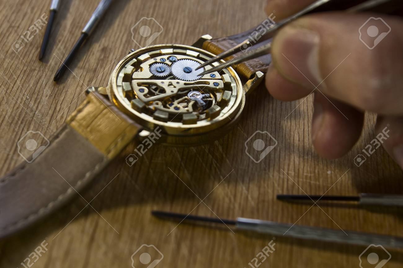 Watchmaker is repairing the mechanical watches in his workshop - 89223789 Watchmaker is repairing the mechanical watches in his workshop - 89223789