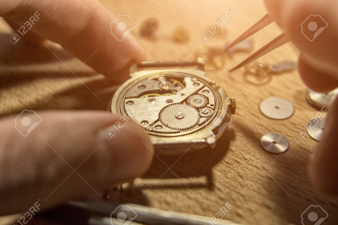 Watchmaker is repairing the mechanical watches in his workshop - 93282965 Watchmaker is repairing the mechanical watches in his workshop - 93282965