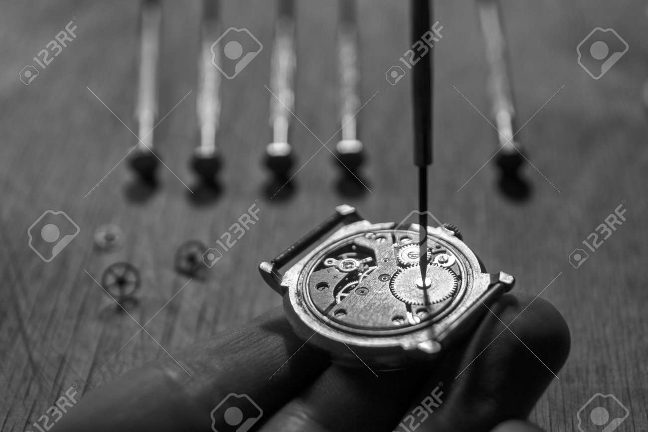 Watchmaker is repairing the mechanical watches in his workshop - 93319531 Watchmaker is repairing the mechanical watches in his workshop - 93319531