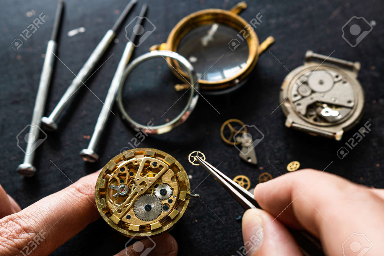 Watchmaker is repearing mechanical wrist watch - 155783743 Watchmaker is repearing mechanical wrist watch - 155783743