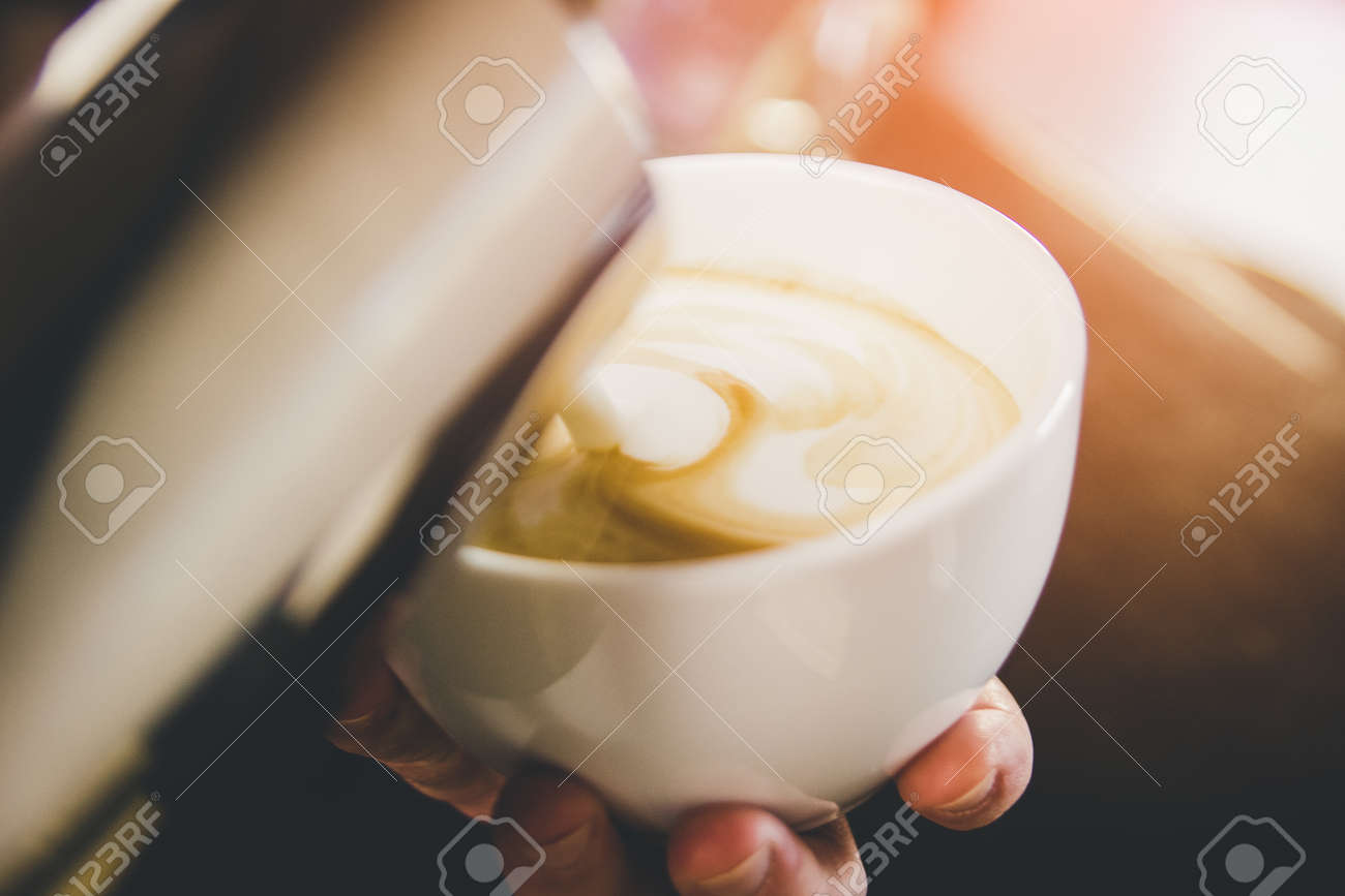 Hand on Barista making latte cafe - 155783825 Hand on Barista making latte cafe - 155783825