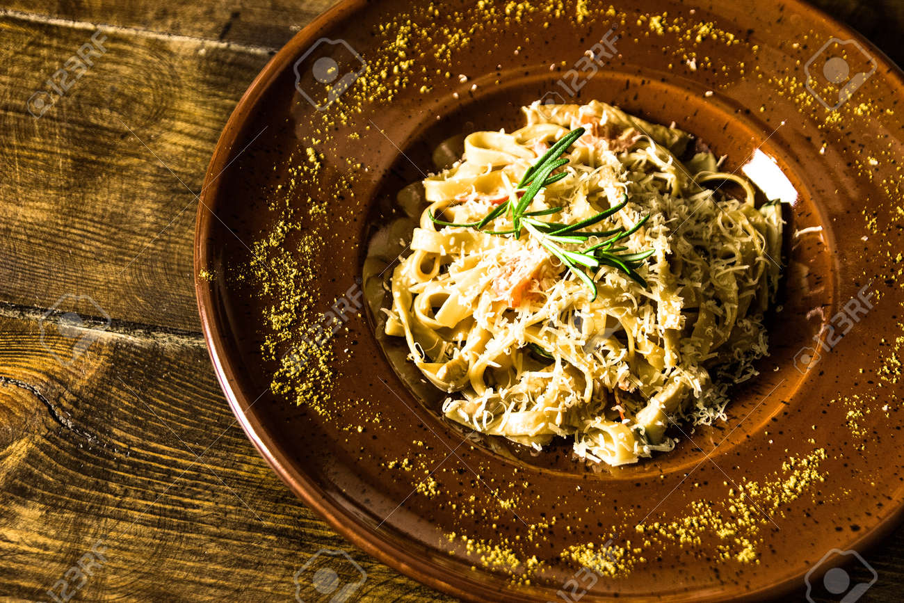 Delicious italian pasta on wooden background - 155783375 Delicious italian pasta on wooden background - 155783375