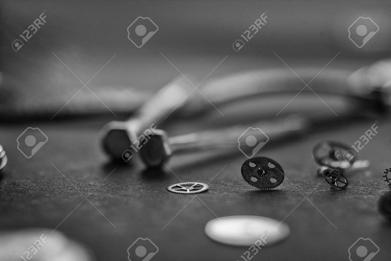 Mechanical watch assembly, watchmakers workshop with many parts and gears - 158412643 Mechanical watch assembly, watchmakers workshop with many parts and gears - 158412643