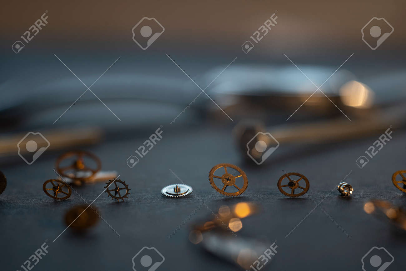 Mechanical watch assembly, watchmakers workshop with many parts and gears - 158412646 Mechanical watch assembly, watchmakers workshop with many parts and gears - 158412646