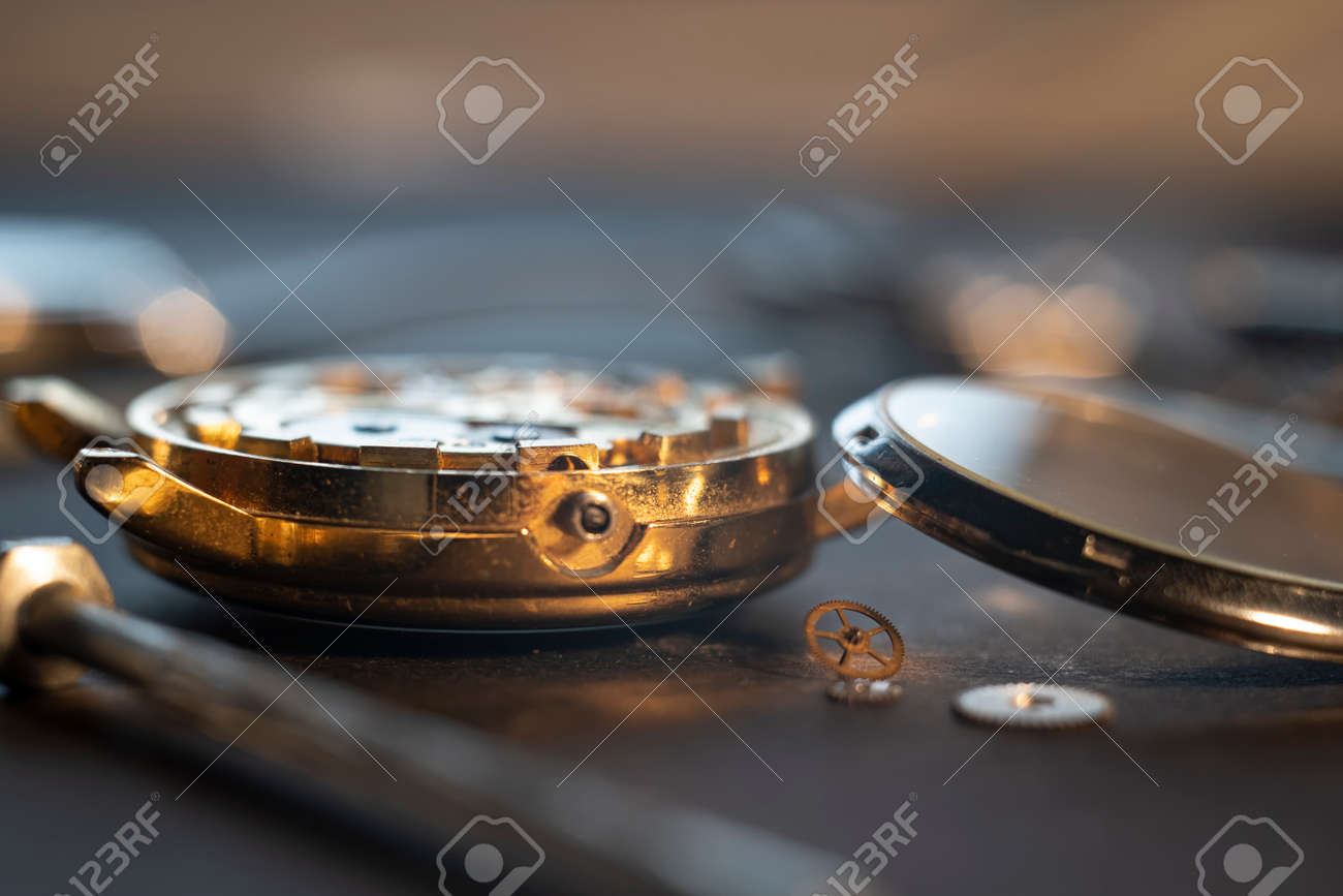 Mechanical watch assembly, watchmakers workshop with many parts and gears - 158412651 Mechanical watch assembly, watchmakers workshop with many parts and gears - 158412651