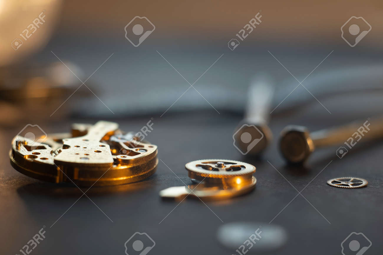 Mechanical watch assembly, watchmakers workshop with many parts and gears - 158412654 Mechanical watch assembly, watchmakers workshop with many parts and gears - 158412654