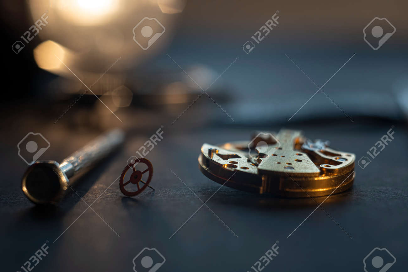 Mechanical watch assembly, watchmakers workshop with many parts and gears - 158412657 Mechanical watch assembly, watchmakers workshop with many parts and gears - 158412657