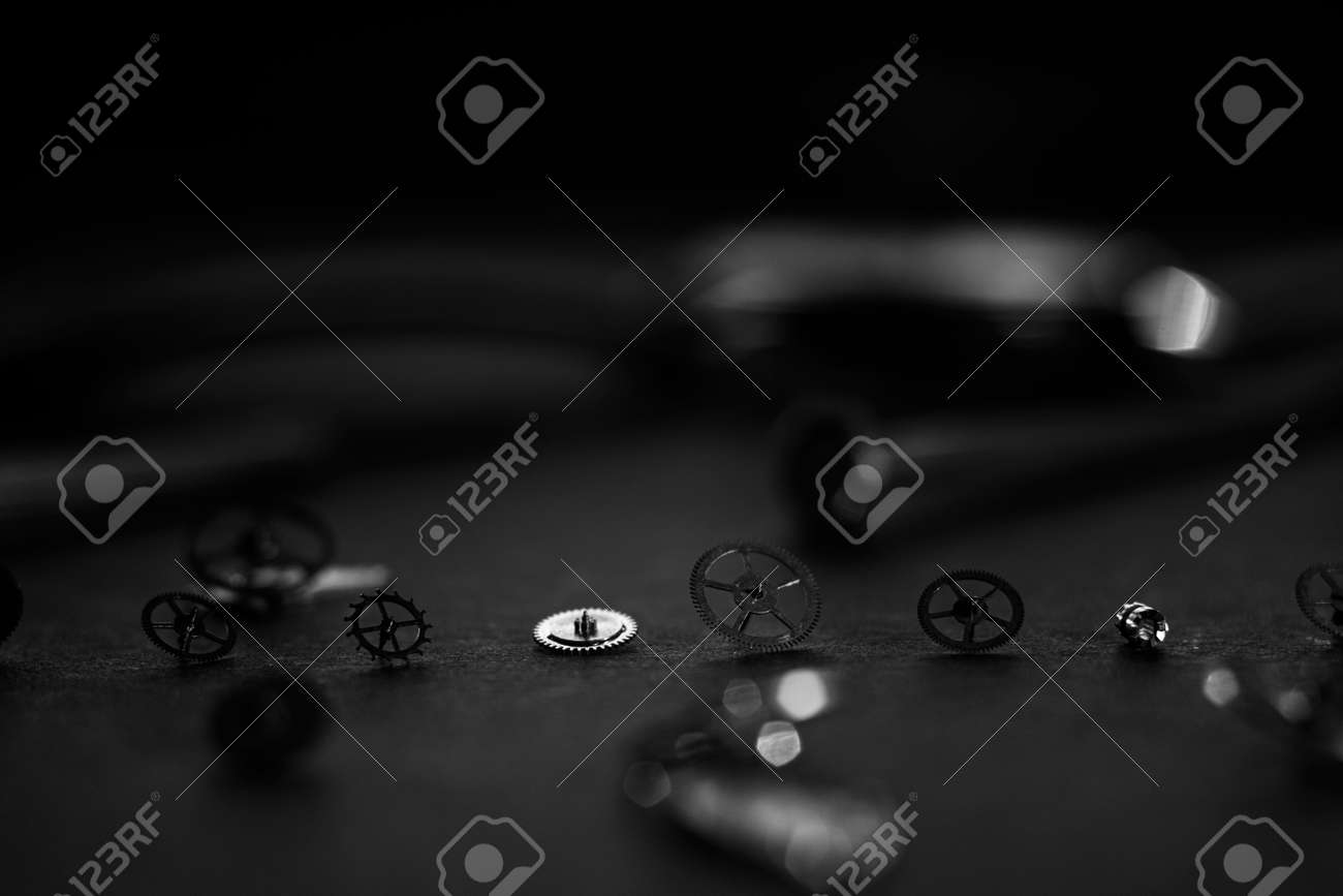 Mechanical watch assembly, watchmakers workshop with many parts and gears - 158412663 Mechanical watch assembly, watchmakers workshop with many parts and gears - 158412663