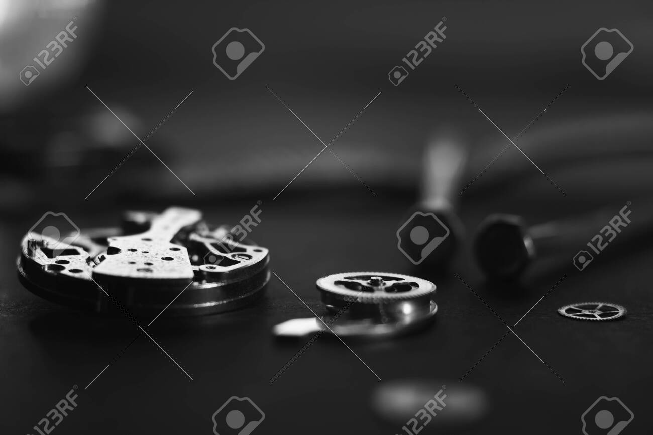 Mechanical watch assembly, watchmakers workshop with many parts and gears - 158412664 Mechanical watch assembly, watchmakers workshop with many parts and gears - 158412664