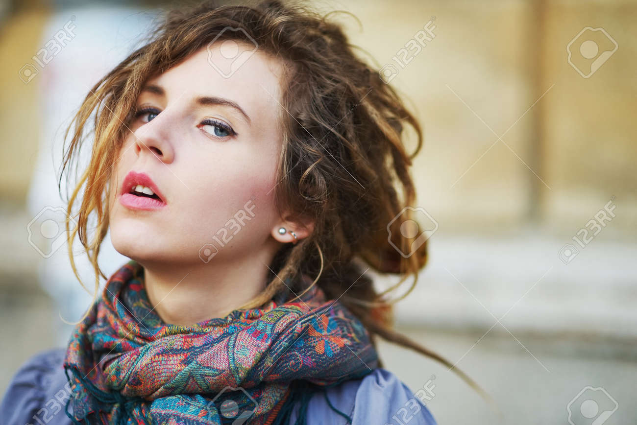 Portrait Of Cute Girl With Dreadlocks Wearing A Scarf On Neck