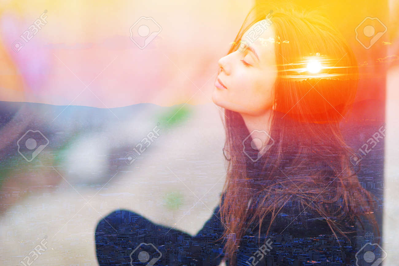 Double multiply exposure portrait of a dreamy cute woman meditating outdoors with eyes closed, combined with photograph of nature, sunrise or sunset. closeup. Psychology power of mind concept. - 140166923