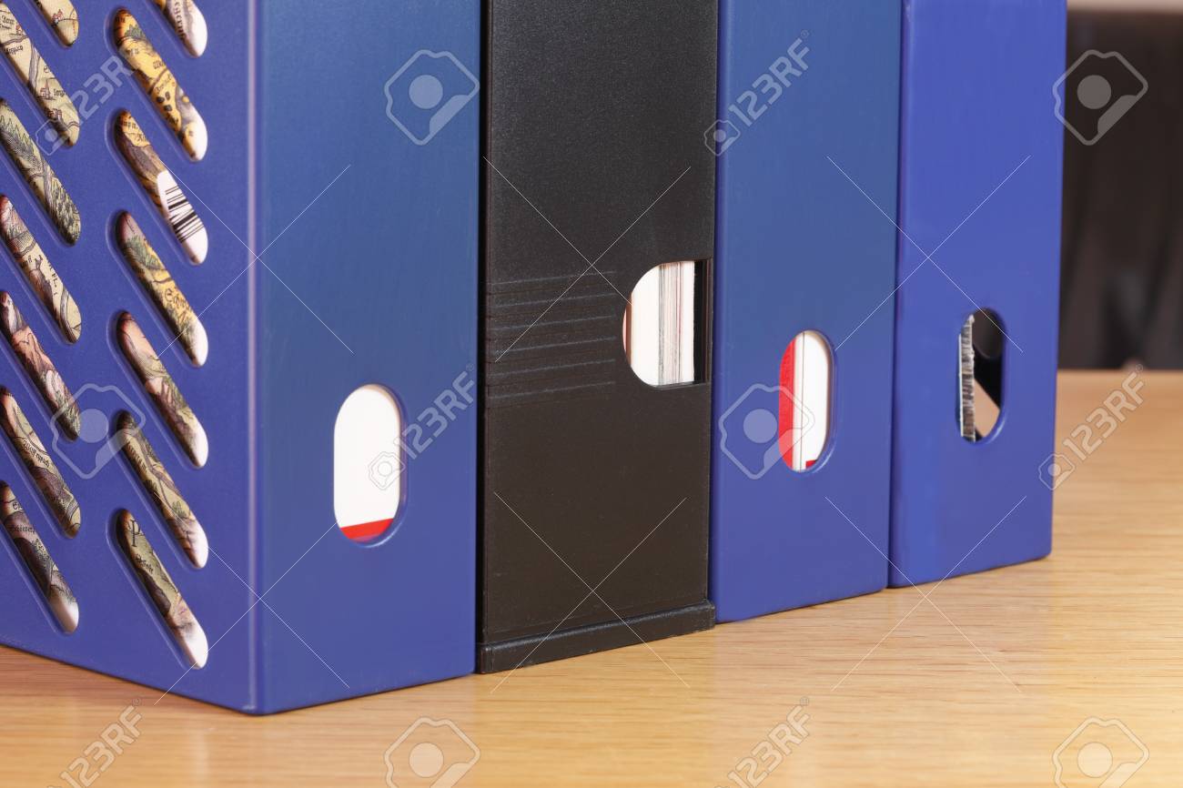 stack of blue binders