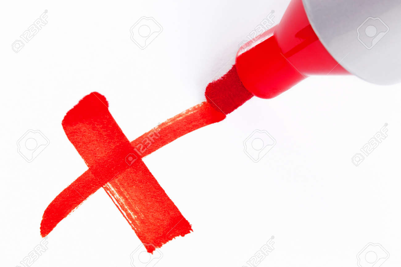 Close-up photo of a big red felt tip marker pen writing a cross X on white paper - 19882897 Close-up photo of a big red felt tip marker pen writing a cross X on white paper - 19882897