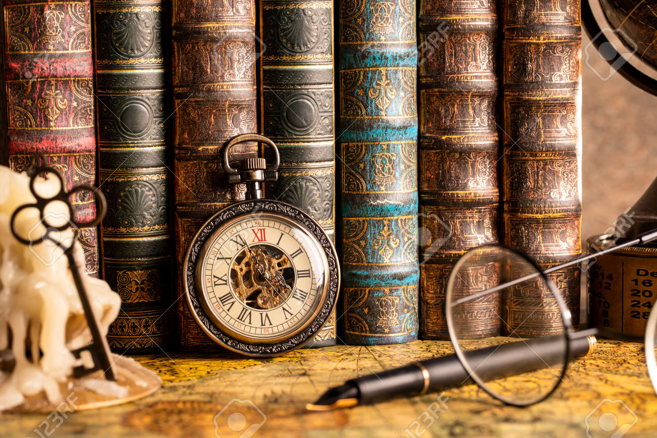Antique Clock On The Background Of A Candle With A Key And Books. Vintage  Style. 1565 Old Map Of The Year. Stock Photo, Picture and Royalty Free  Image. Image 117167841., image size:1300x867