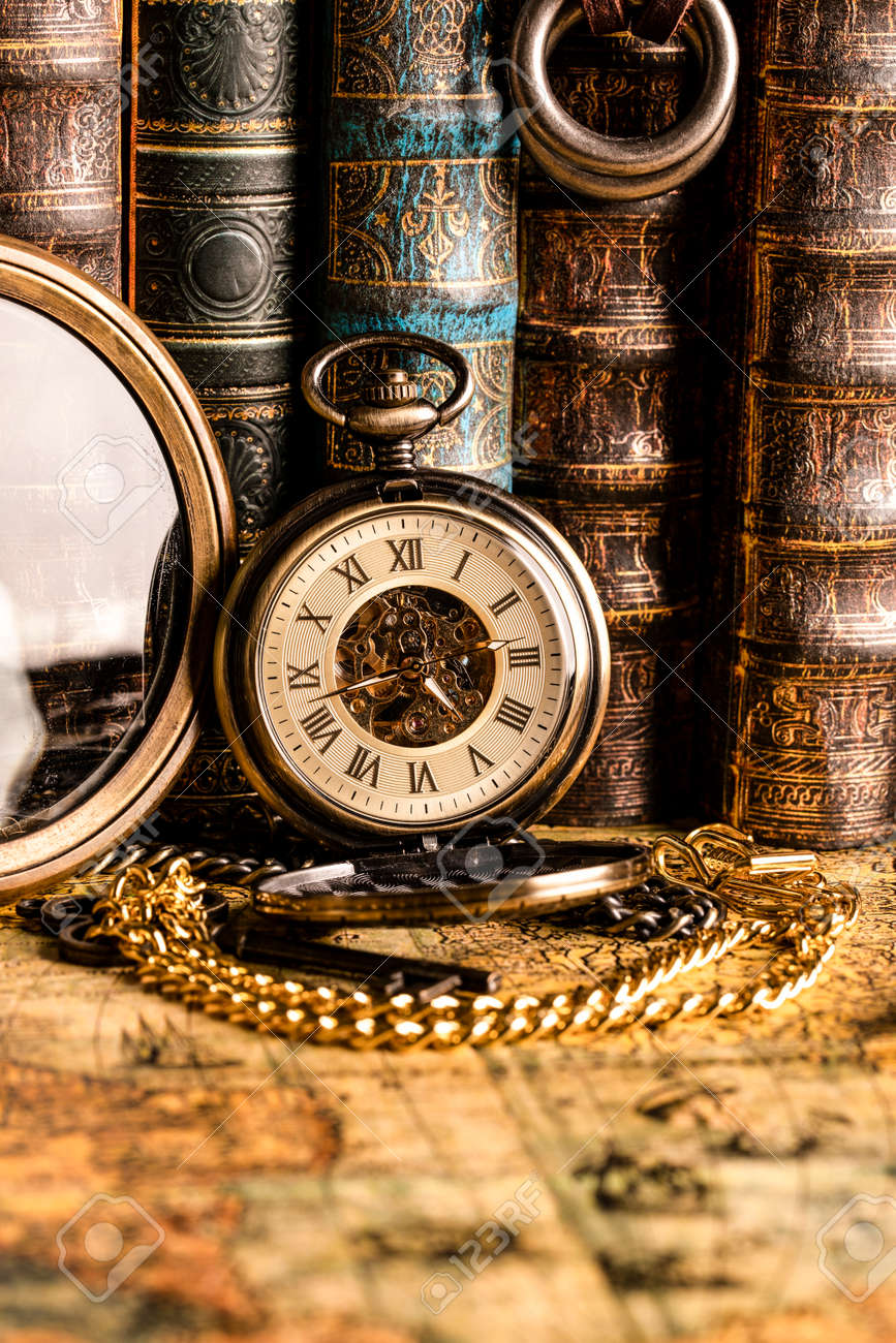 Antique Clock On The Background Of A Magnifying Glass And Books. Vintage  Style. 1565 Old Map Of The Year. Stock Photo, Picture and Royalty Free  Image. Image 122120965., image size:867x1300