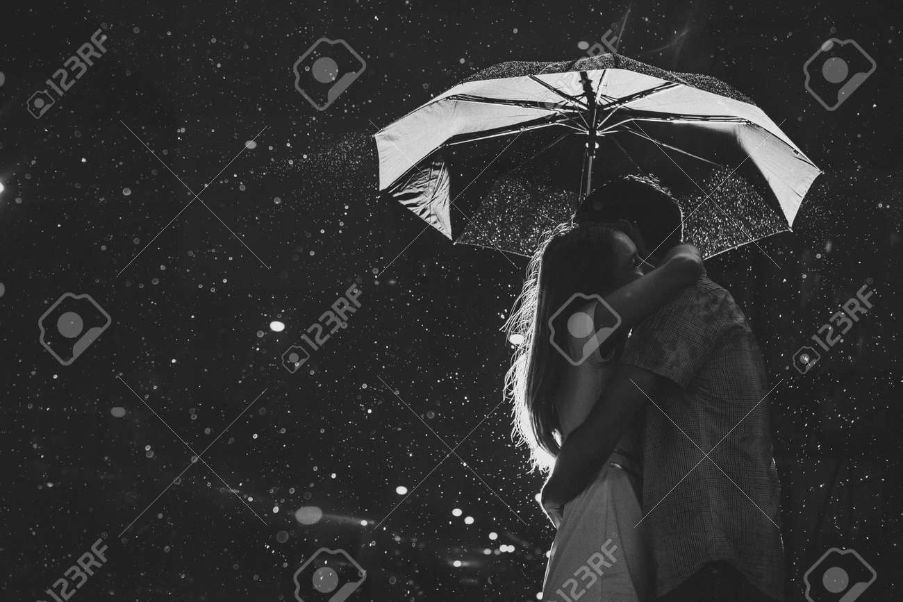 Love In The Rain / Silhouette Of Kissing Couple Under Umbrella Stock Photo,  Picture and Royalty Free Image. Image 23688664., image size:1300x867