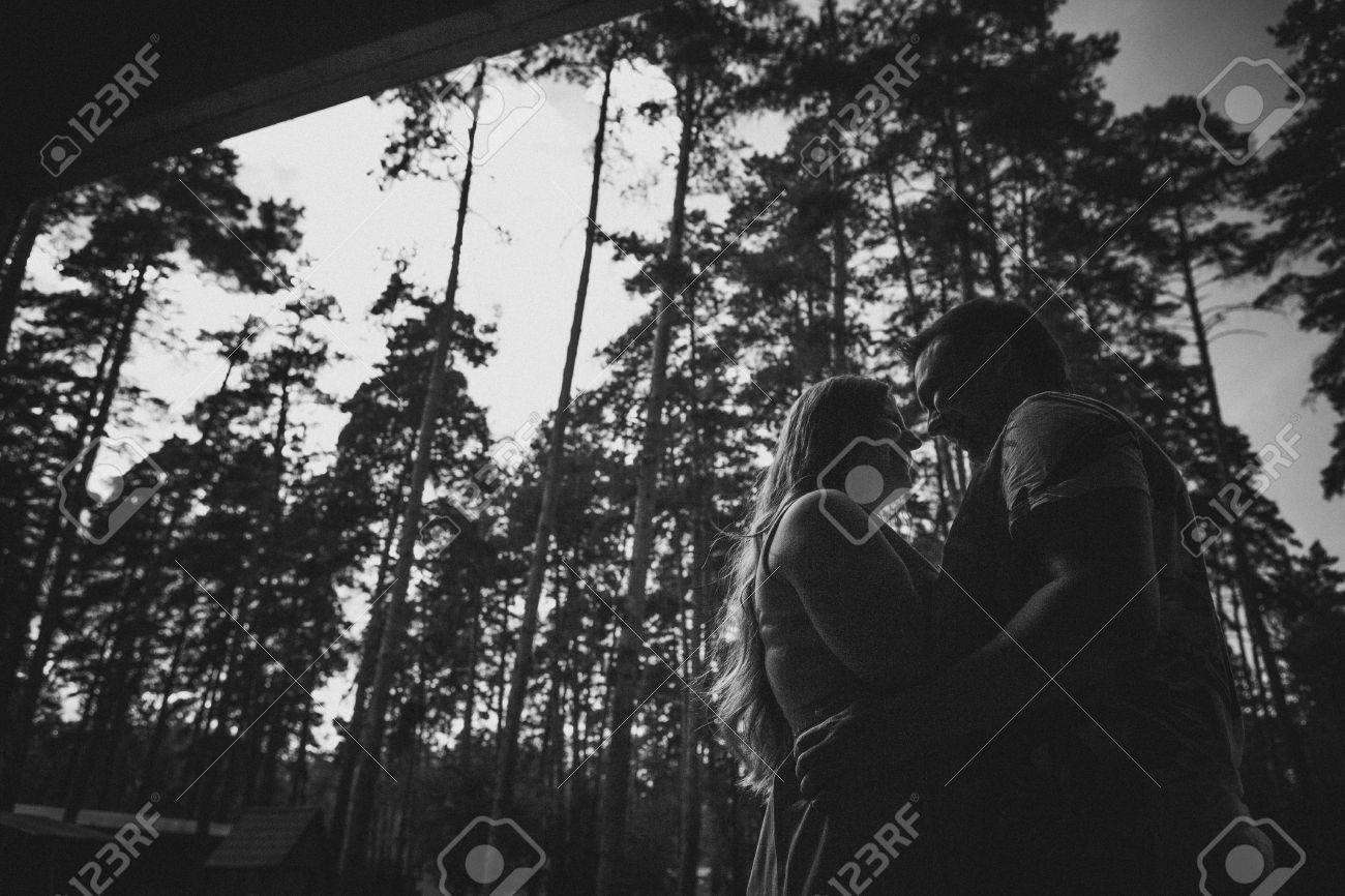 Romantic black and white photo young couple kissing on background summer forest stock photo 47073777
