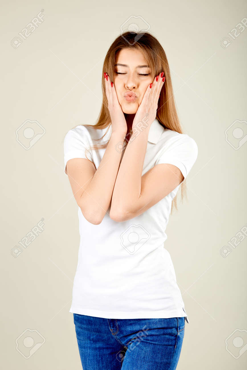 white polo shirt and blue jeans