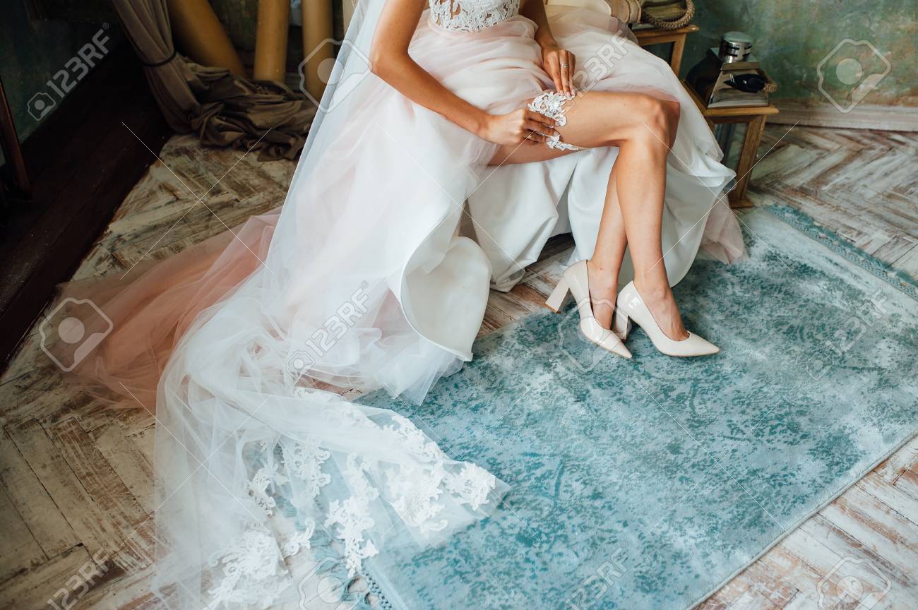 Garter On The Leg Of A Bride Slim Sexy Bride In Wedding Luxury Stock Photo Picture And Royalty Free Image Image 90849387