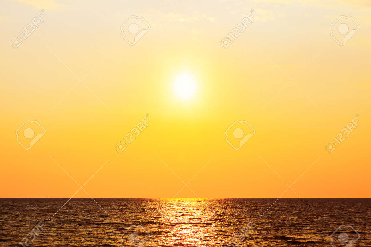 Sundown over the sea . Follow the sun . Sun over the open sea in the evening - 167986653 Sundown over the sea . Follow the sun . Sun over the open sea in the evening - 167986653